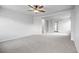 Spacious bonus room features an open floor plan with neutral colors and modern ceiling fan for comfort at 5842 High Timber Cir, Castle Rock, CO 80104