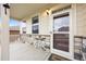 Inviting front porch with stone accents, well-lit entrance, and covered area at 5842 High Timber Cir, Castle Rock, CO 80104