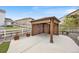 Outdoor wooden gazebo with seating, landscaping, and a view of the backyard at 5842 High Timber Cir, Castle Rock, CO 80104