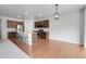 Spacious kitchen featuring modern appliances, granite countertops, and an island with a breakfast bar at 5842 High Timber Cir, Castle Rock, CO 80104