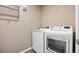 Laundry room includes a white washer and dryer set at 5842 High Timber Cir, Castle Rock, CO 80104