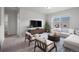 Bright living room with contemporary furnishings, large windows and a cozy seating area with elegant decor at 5842 High Timber Cir, Castle Rock, CO 80104