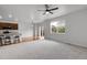Expansive living area flows into the kitchen, boasting ample natural light and modern finishes at 5842 High Timber Cir, Castle Rock, CO 80104