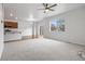 Open-concept living area with a ceiling fan and large window at 5842 High Timber Cir, Castle Rock, CO 80104