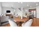 Open-concept living area with kitchen island and dining space at 5842 High Timber Cir, Castle Rock, CO 80104