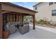 Outdoor patio with covered seating and a landscaped garden at 5842 High Timber Cir, Castle Rock, CO 80104