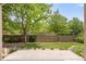 Manicured backyard featuring a small artificial lawn, stepping stones and a privacy fence at 6700 W Dorado Dr # 41, Littleton, CO 80123