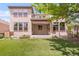 Spacious backyard featuring a lawn, second story deck and mature trees at 6700 W Dorado Dr # 41, Littleton, CO 80123