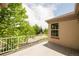 Inviting balcony with a view of mature trees, offering a serene outdoor space for relaxation and enjoying nature at 6700 W Dorado Dr # 41, Littleton, CO 80123