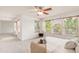 Inviting bedroom featuring a ceiling fan, three large windows, and a cozy seating area, creating a relaxing atmosphere at 6700 W Dorado Dr # 41, Littleton, CO 80123