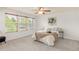 Bright bedroom with a ceiling fan, many windows providing natural light, and a cozy neutral-toned color scheme at 6700 W Dorado Dr # 41, Littleton, CO 80123