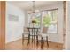 Dining area with natural light, wood flooring, and chandelier lighting at 6700 W Dorado Dr # 41, Littleton, CO 80123