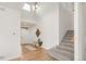 Bright foyer with skylight, hardwood floors, and staircase at 6700 W Dorado Dr # 41, Littleton, CO 80123