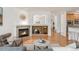 Cozy living room featuring a fireplace, hardwood floors, and an open floor plan at 6700 W Dorado Dr # 41, Littleton, CO 80123