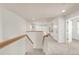 Upstairs hallway and landing with built-in shelves and a window seat at 6700 W Dorado Dr # 41, Littleton, CO 80123