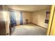 Spacious bedroom featuring a large window for natural light and neutral carpeting at 14102 E Colorado Dr # 102, Aurora, CO 80012