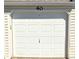 Garage door with an electronic opener for easy and secured access at 14102 E Colorado Dr # 102, Aurora, CO 80012