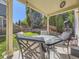 Inviting back patio perfect for outdoor dining with an outdoor table and seating, complemented by a green lawn at 2508 Coach House Loop, Castle Rock, CO 80109