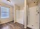 Full bathroom featuring a tub and shower combination with modern fixtures and wood look flooring at 2508 Coach House Loop, Castle Rock, CO 80109