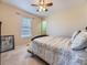 Bedroom featuring a bed with a patterned comforter, and a large window with natural light at 2508 Coach House Loop, Castle Rock, CO 80109