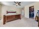 Bedroom features carpeted floors, a closet and a wooden bed frame at 2508 Coach House Loop, Castle Rock, CO 80109