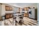 Stylish kitchen featuring wood cabinets, stainless steel appliances, and an island with seating at 2508 Coach House Loop, Castle Rock, CO 80109