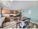 Well-lit kitchen with wood cabinets, a farmhouse island, and stainless steel appliances at 2508 Coach House Loop, Castle Rock, CO 80109