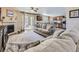 Open-concept living room with a fireplace and sliding glass doors, connected to the kitchen at 2508 Coach House Loop, Castle Rock, CO 80109