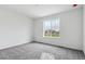 Bedroom featuring carpet flooring and a bright window providing natural light at 9277 Truckee Ct, Commerce City, CO 80022
