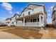 Charming two-story home with a welcoming front porch and a well-lit exterior at 9277 Truckee Ct, Commerce City, CO 80022