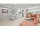 Finished basement area with plush carpet, a kitchenette, and comfortable seating at 6242 Shea Pl, Highlands Ranch, CO 80130