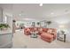 Large, carpeted basement living area with a comfortable sectional sofa and ample lighting at 6242 Shea Pl, Highlands Ranch, CO 80130