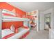 Bright bedroom with bunk beds, carpeted floors and mirrored closet doors at 6242 Shea Pl, Highlands Ranch, CO 80130