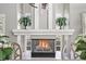 Detailed view of the fireplace and decorative elements in the dining room at 6242 Shea Pl, Highlands Ranch, CO 80130