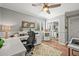Comfortable and well-lit office space with a desk, storage, and a calming neutral color palette at 6242 Shea Pl, Highlands Ranch, CO 80130