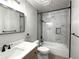 Clean bathroom with marble-tiled shower/tub combo and modern vanity at 3705 Quail St # 4, Wheat Ridge, CO 80033