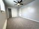 Bright bedroom with ceiling fan, carpet, and spacious closet at 3705 Quail St # 4, Wheat Ridge, CO 80033