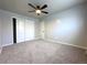 Bright bedroom with ceiling fan, carpet, and double closet at 3705 Quail St # 4, Wheat Ridge, CO 80033