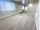 Open living room with carpeted floor and neutral color scheme at 3705 Quail St # 4, Wheat Ridge, CO 80033