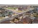 Overhead view of a neighborhood featuring residential homes, a playground, and green spaces at 10995 Quintero St, Commerce City, CO 80022