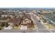 Aerial view of a two-story home in a neighborhood with mountain views in the distance at 10995 Quintero St, Commerce City, CO 80022