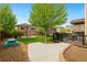 Expansive backyard with a patio area, lush lawn, landscaping, perfect for outdoor enjoyment and relaxation at 10995 Quintero St, Commerce City, CO 80022