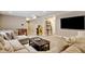 Relaxing basement area with comfortable seating, large TV, and games for entertainment at 10995 Quintero St, Commerce City, CO 80022