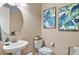 Well-appointed powder room featuring a stylish vanity, modern fixtures, and elegant decor at 10995 Quintero St, Commerce City, CO 80022