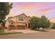 Beautiful two-story home featuring a three-car garage, a basketball hoop, and a well-manicured lawn at 10995 Quintero St, Commerce City, CO 80022