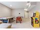 Basement game room with foosball, Pac-Personal arcade game, and potential for fun at 10995 Quintero St, Commerce City, CO 80022