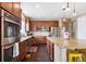 Well-equipped kitchen featuring stainless steel appliances, granite countertops, and a convenient layout for cooking at 10995 Quintero St, Commerce City, CO 80022