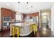 Open kitchen with a large center island, stainless steel appliances, and ample cabinet space for storage at 10995 Quintero St, Commerce City, CO 80022
