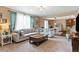 Comfortable living room area with view to dining room at 10995 Quintero St, Commerce City, CO 80022
