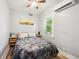 Cozy bedroom with neutral walls and a large window to allow for ample natural light at 1456 Syracuse St, Denver, CO 80220